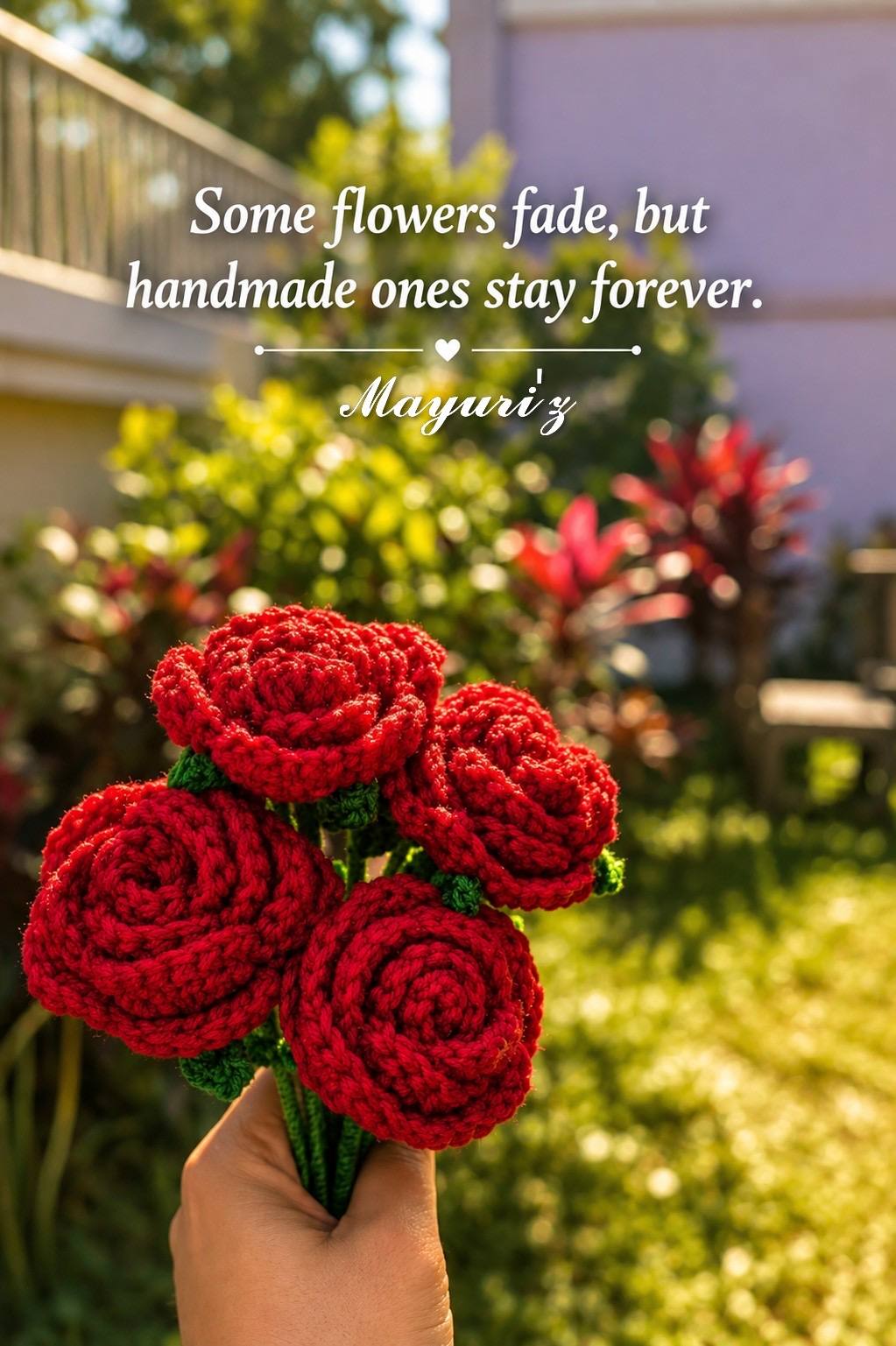 A hand-tied bouquet of five red crochet roses on leafy stems